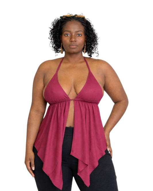 Woman wearing a burgundy halter top with a white background